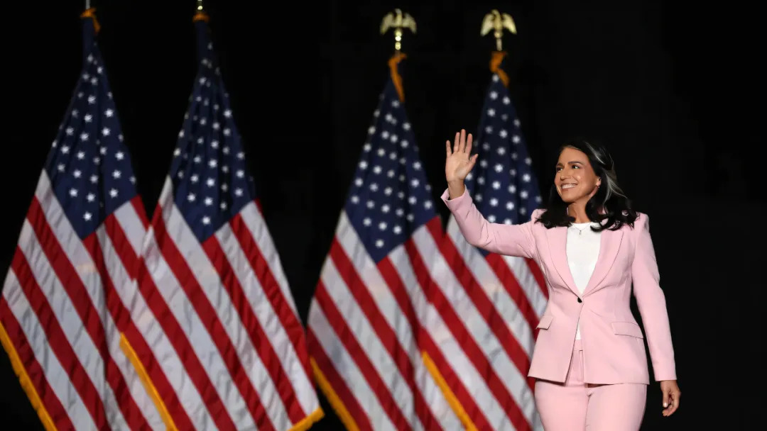 Tulsi Gabbard waves to voters before her speech