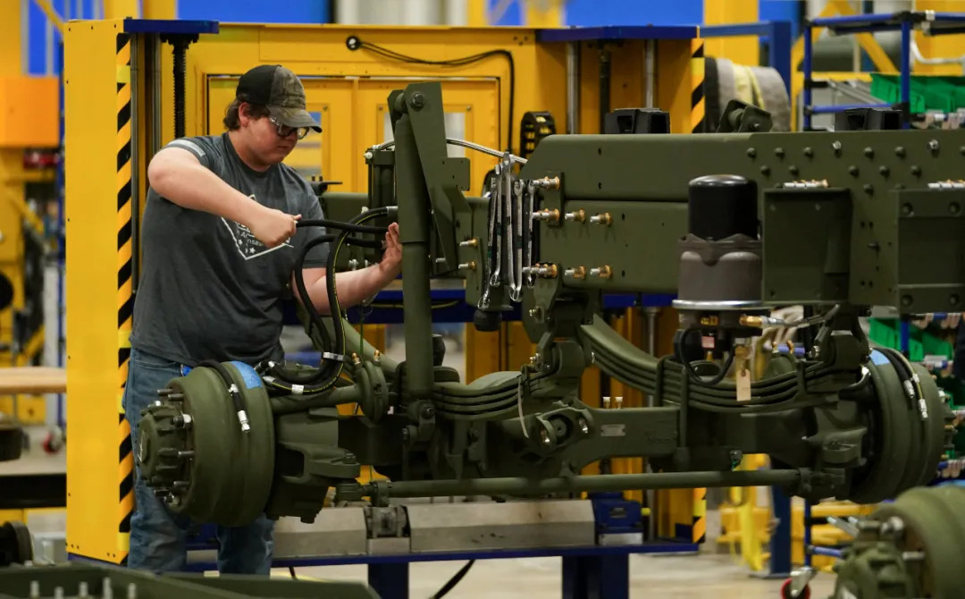 Workers assemble missile launch vehicles in the Lockheed Martin workshop