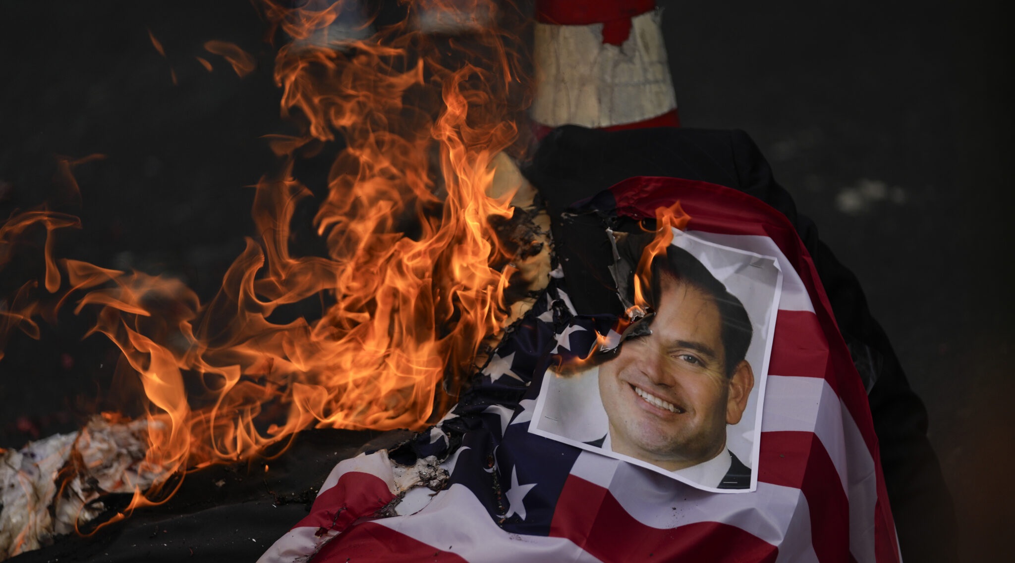 Protesters burn photos of US Secretary of State Marco Rubio when he is about to visit Panama City.